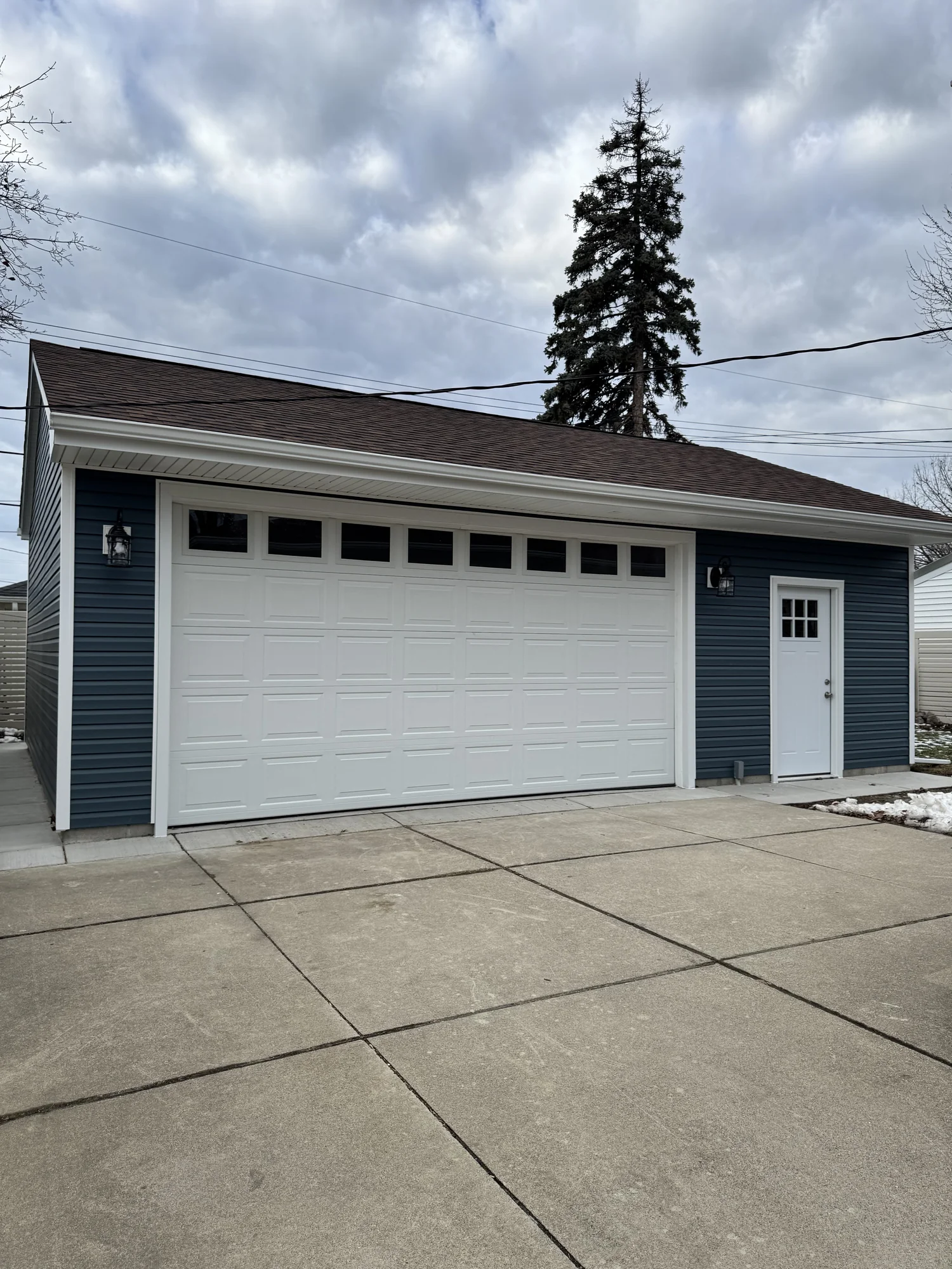 Detached Blue-Siding Garage — photo 1