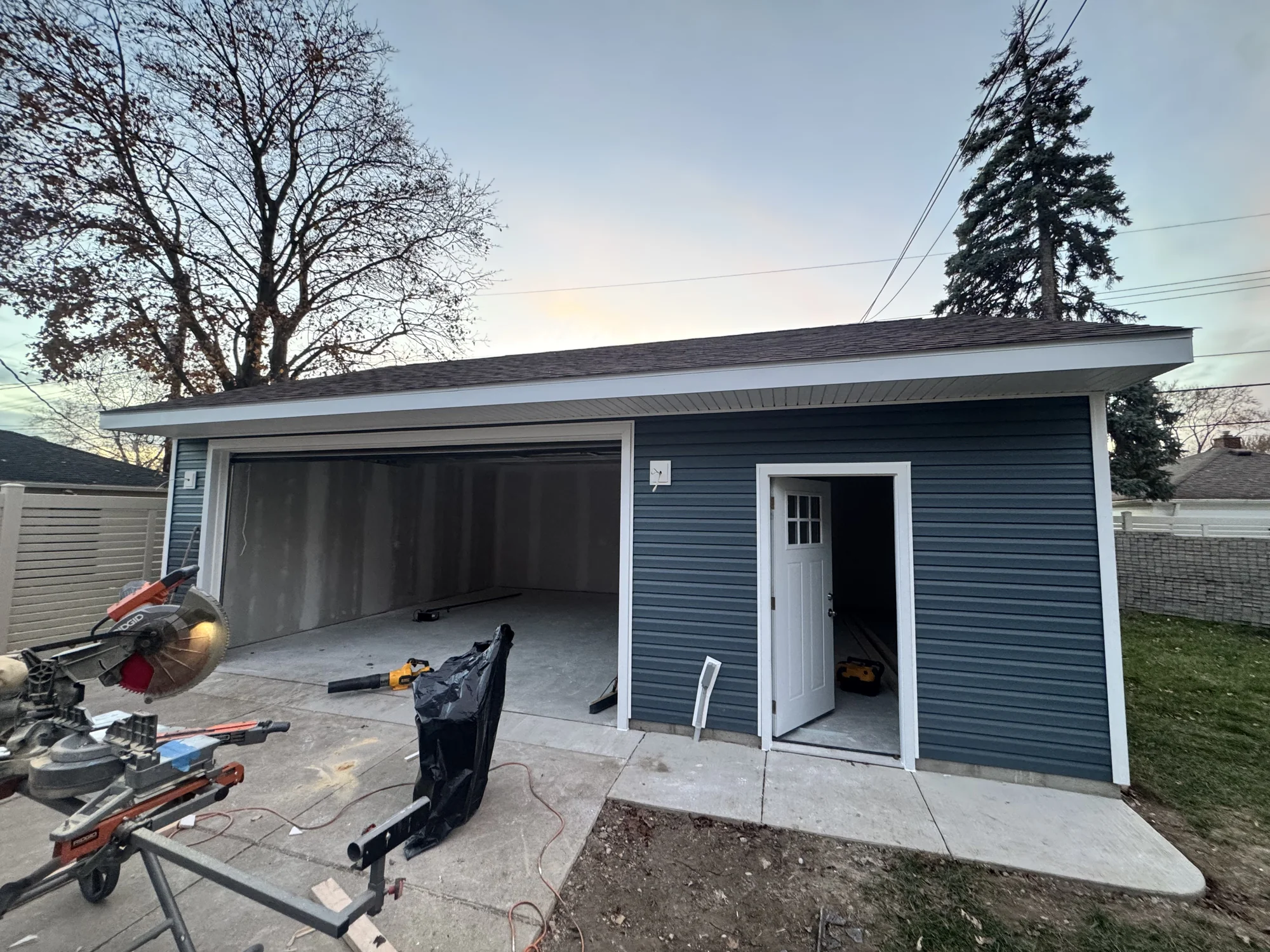 Detached Blue-Siding Garage — photo 4